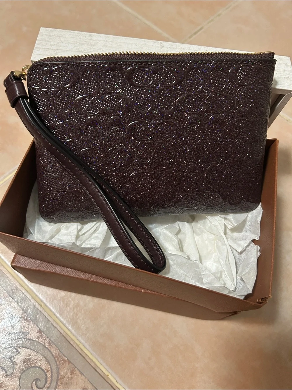 Coach Glitter Embossed Signature Wristlet in Dark Brown